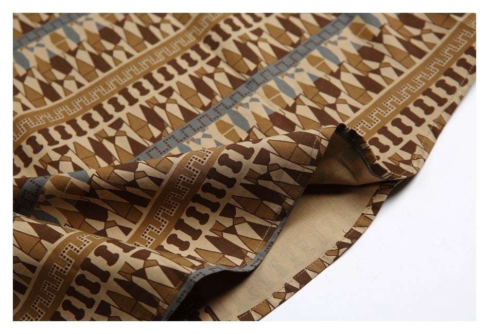 Close-up of the shirt's folded hem, showing the printed exterior and plain tan underside.