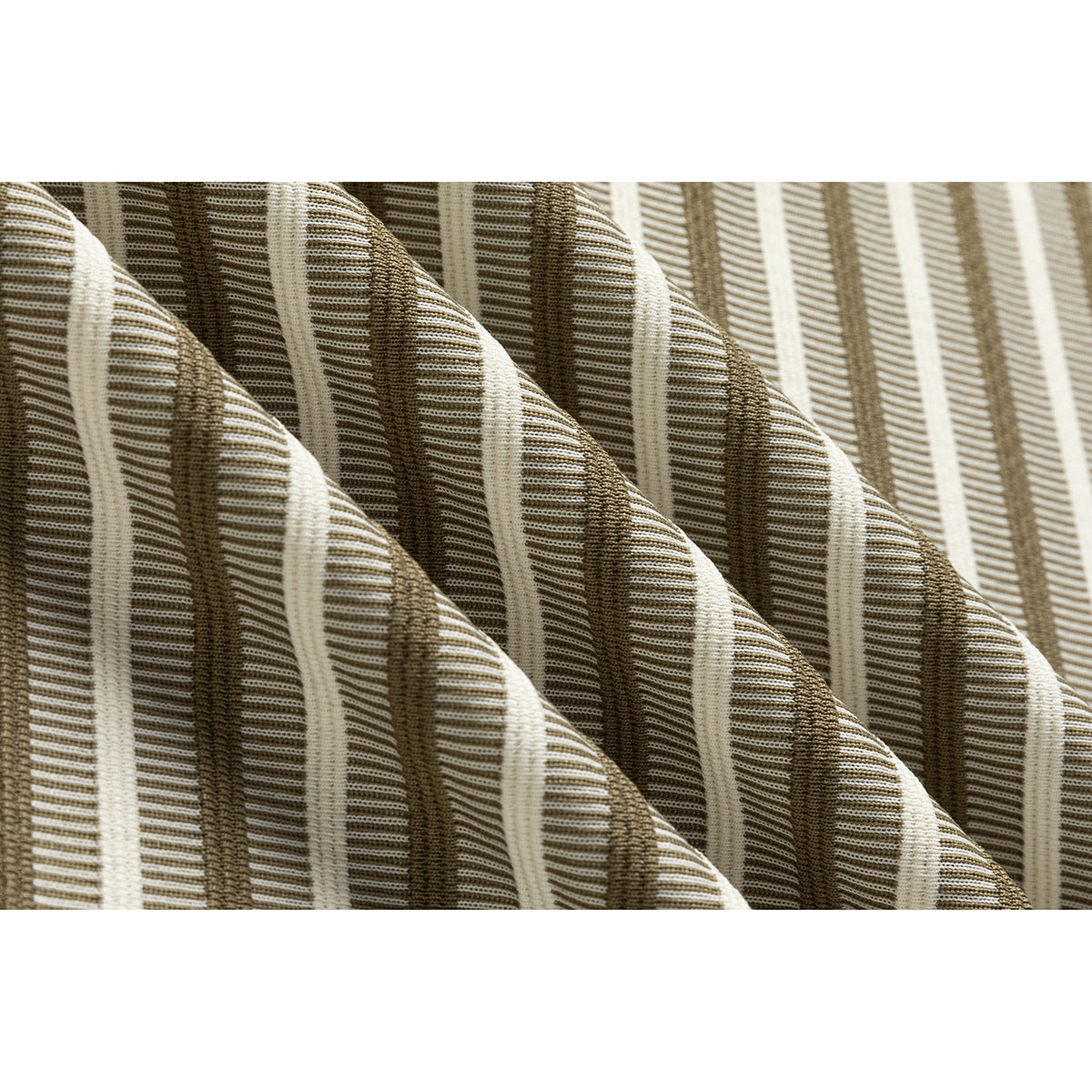 Extreme close-up showing the raised ribbed texture of ivory and brown striped fabric.