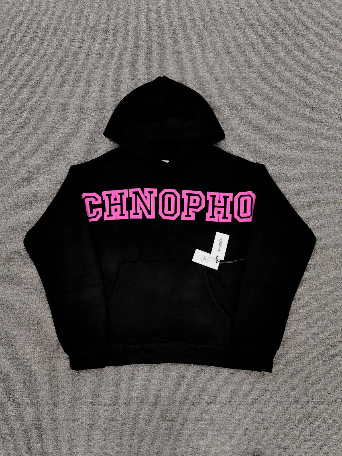 Sp5der black pullover hoodie with bold pink varsity graphic lettering on chest and kangaroo pocket