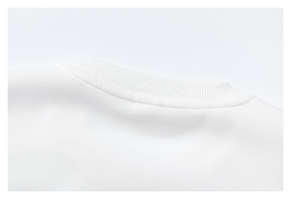 Close-up of the plain back neckline and ribbed collar of a white sweatshirt.
