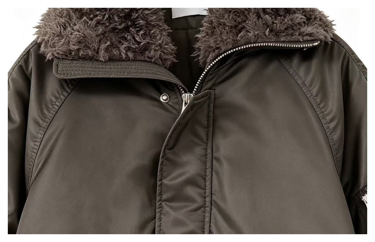 Close-up of the bomber jacket's plush gray collar, front zipper, and snap-fastened storm flap.