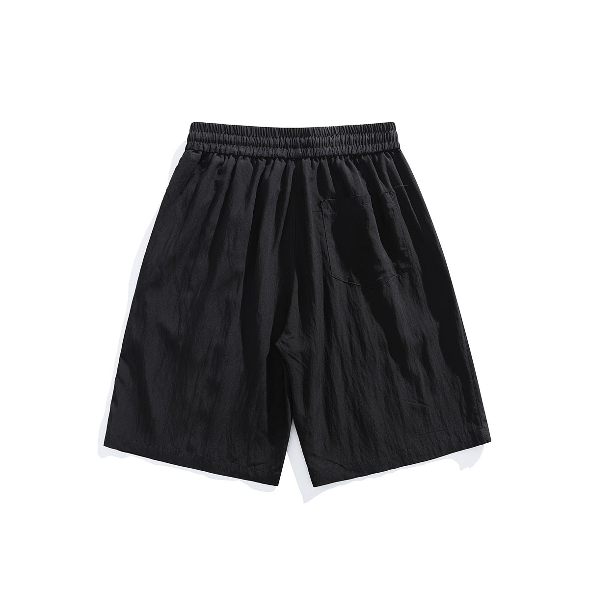 Black crinkled-texture shorts with elastic waistband and back patch pocket, flat lay back view