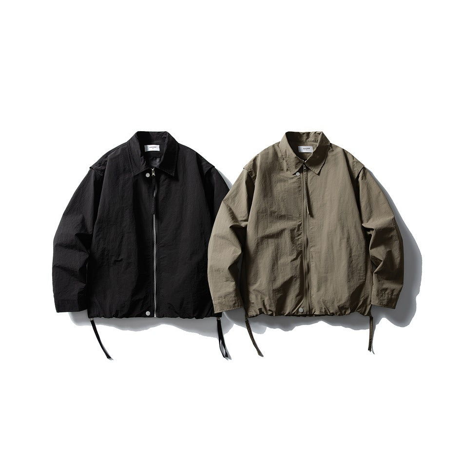 Two front-facing zip jackets shown side by side: one black and one olive-gray, with collars and drawcord hems.