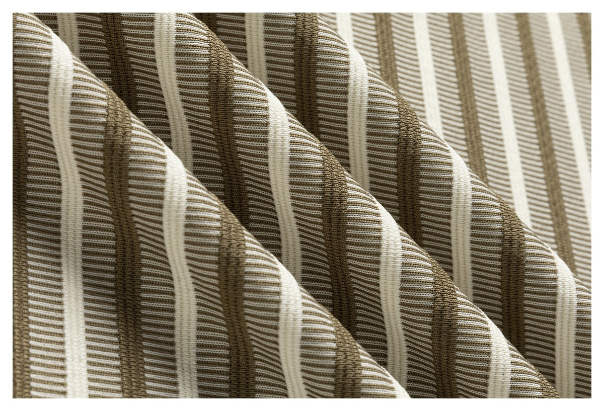 Extreme close-up of the raised ribbed texture in cream-and-taupe striped fabric.