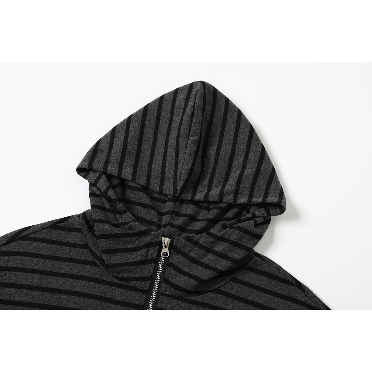 Close-up of a charcoal and black striped hoodie hood and silver front zipper.
