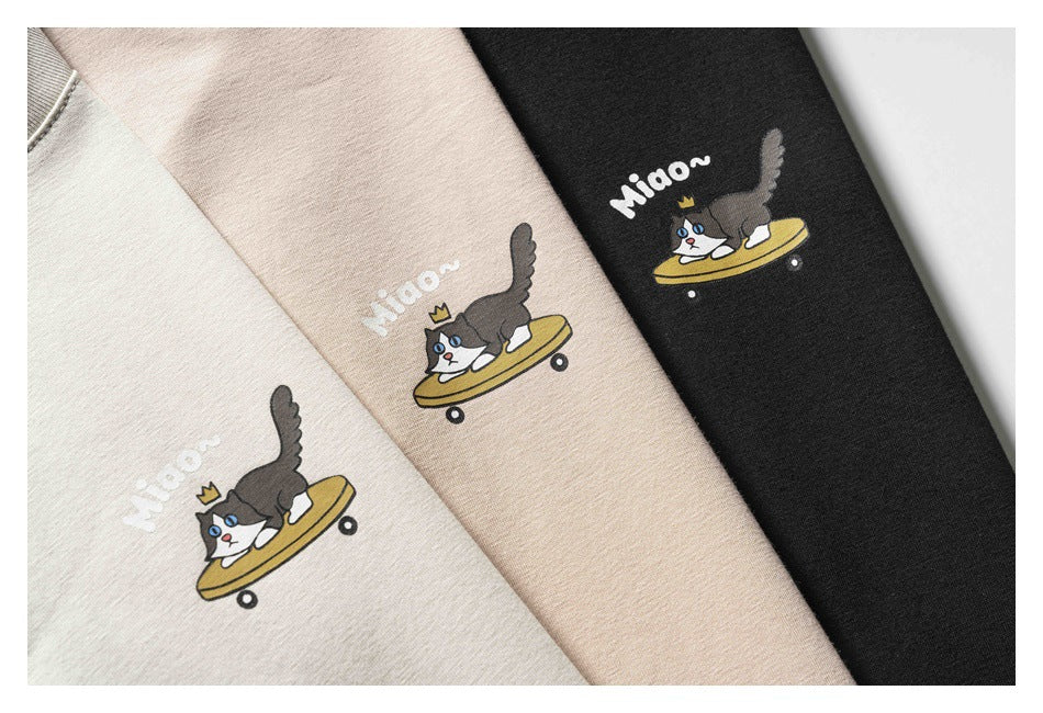 Ivory, beige, and black fabric colorways feature a crowned cat riding a skateboard with “Miaow” text.