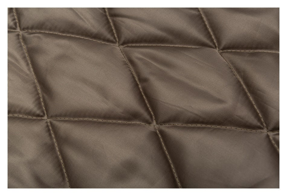 Close-up of taupe-brown fabric with large geometric quilted stitching.