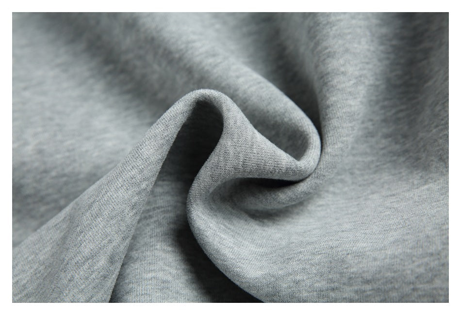 Close-up of heather-gray fabric draped into soft folds.