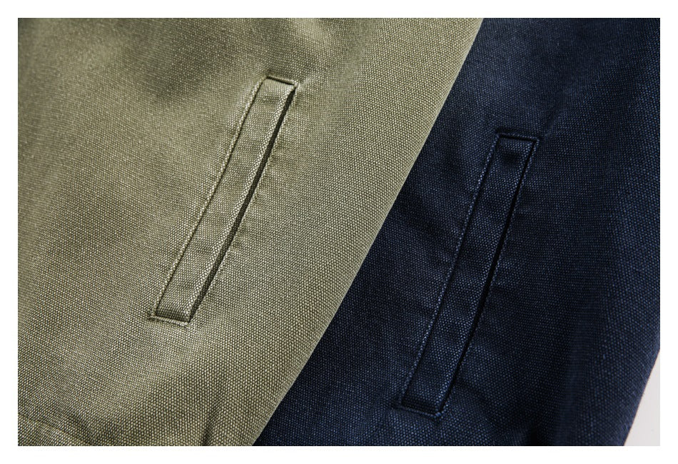 Close-up of slanted pocket openings on olive and navy garments.