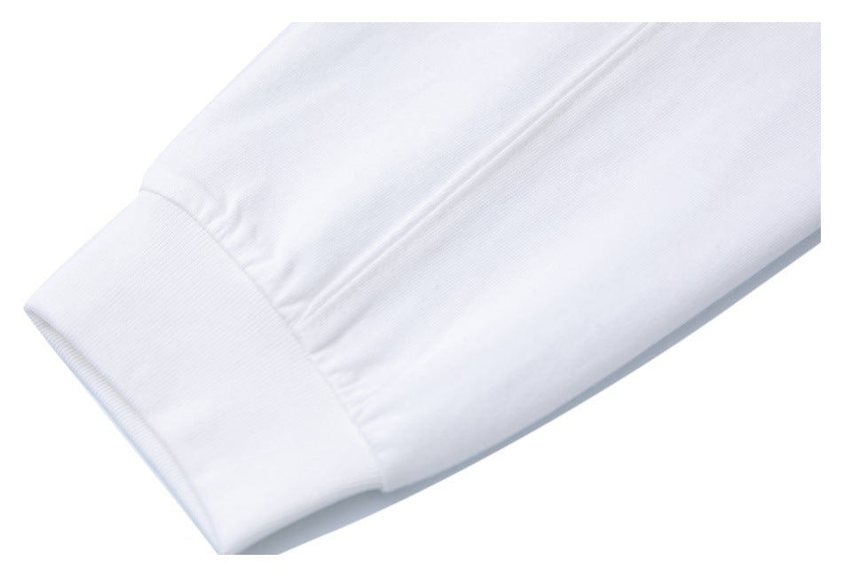 Close-up of a white sleeve ending in a wide ribbed cuff.