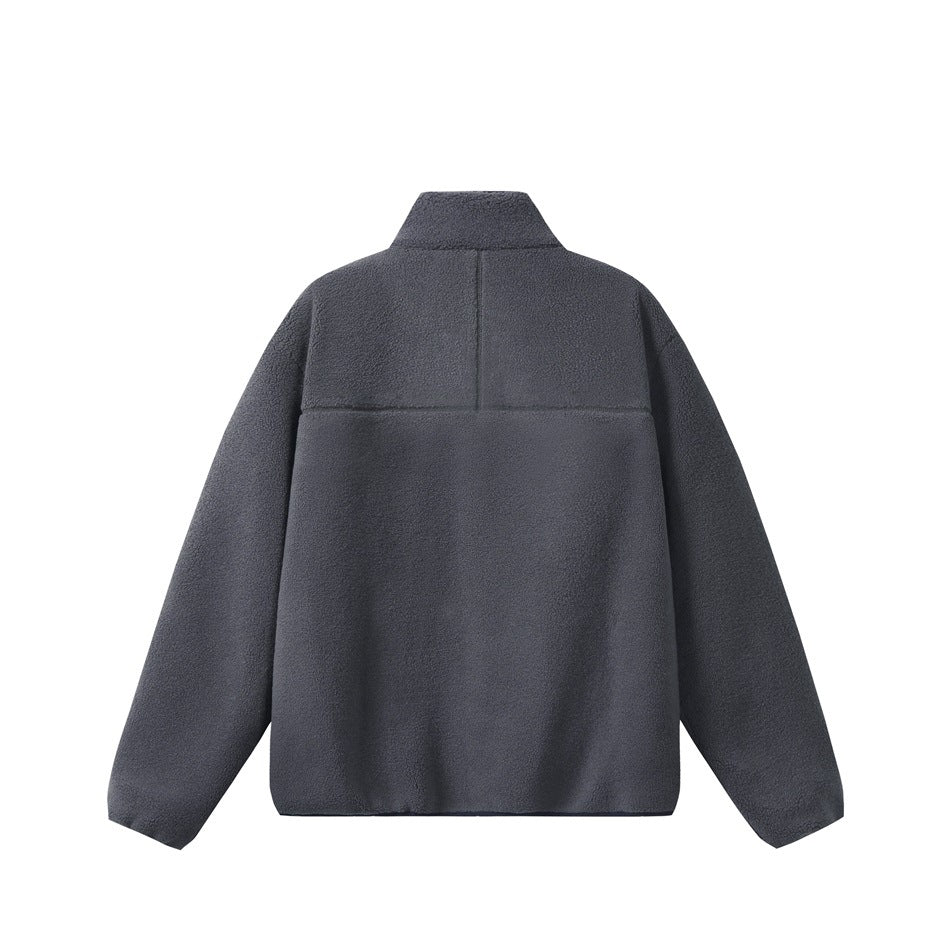 Back view of a charcoal blue fleece jacket with a stand collar and a horizontal yoke seam.