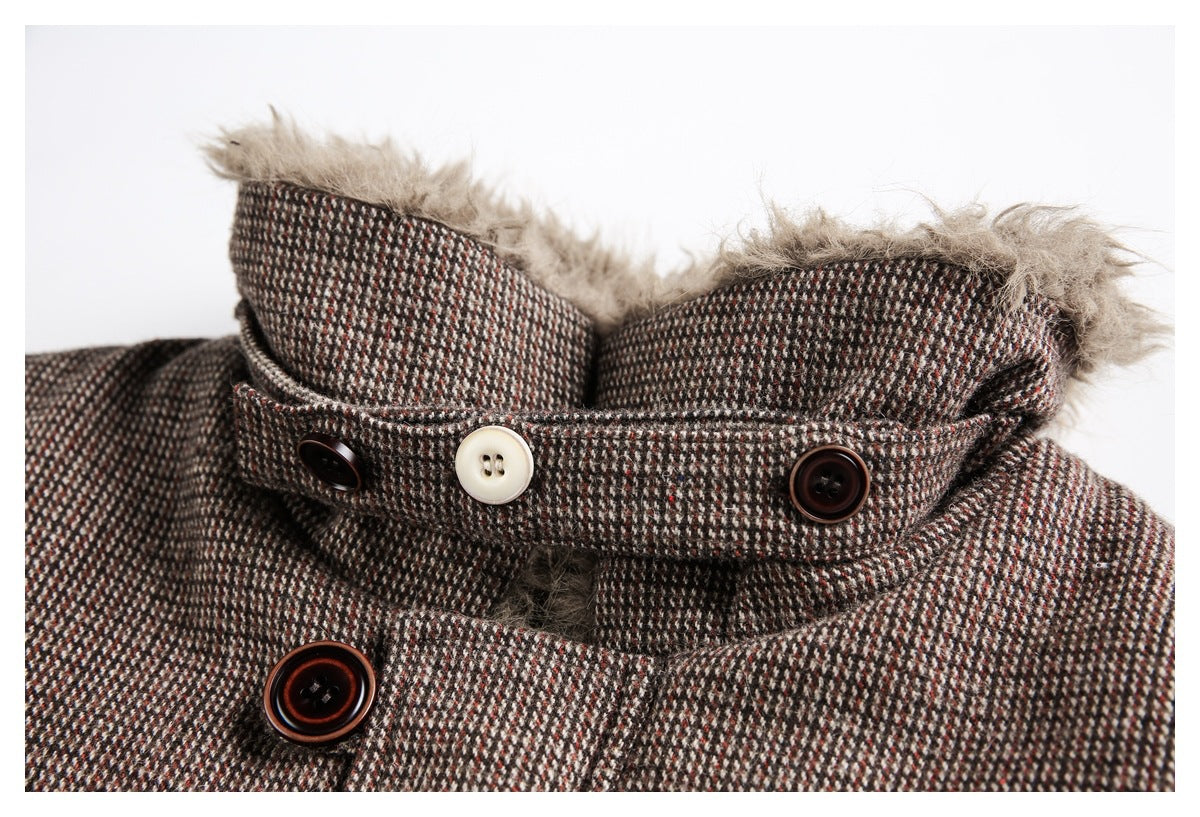 Close-up of a brown, cream, and rust patterned coat collar with beige faux-fur trim and contrasting buttons.