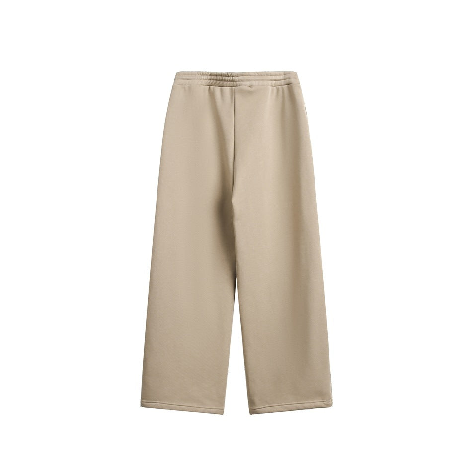 Front view of plain beige wide-leg pants with an elastic waistband.