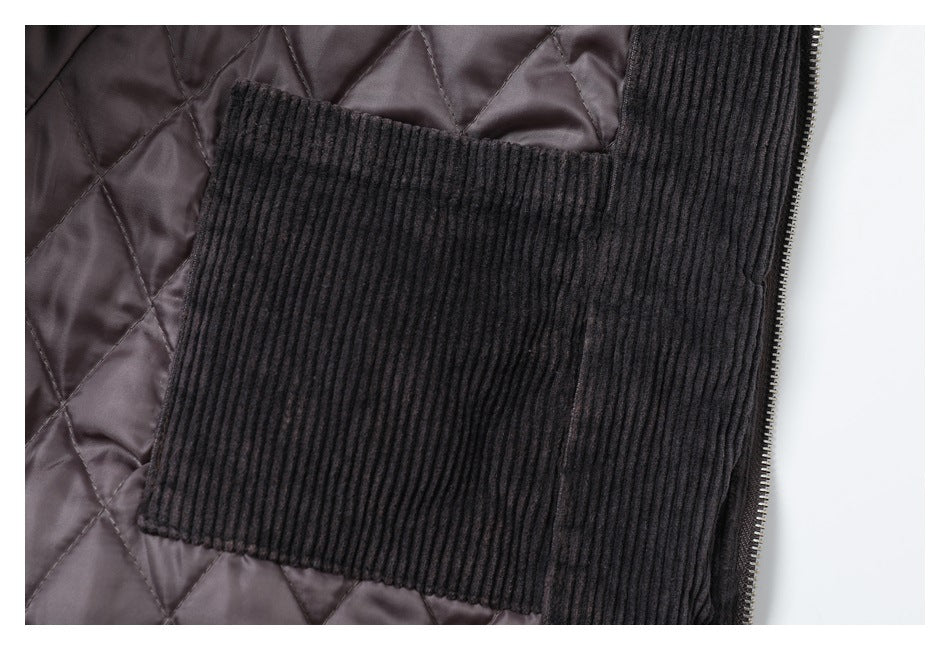Close-up of a large ribbed interior pocket against the jacket's quilted lining.