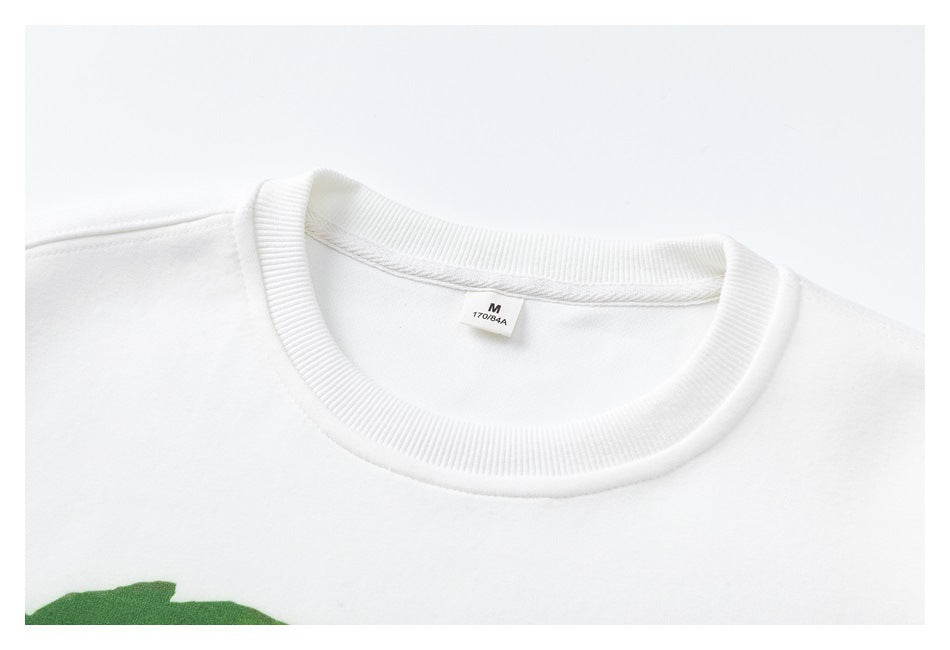 Close-up of a white crew neckline with ribbed trim and a small neck label.