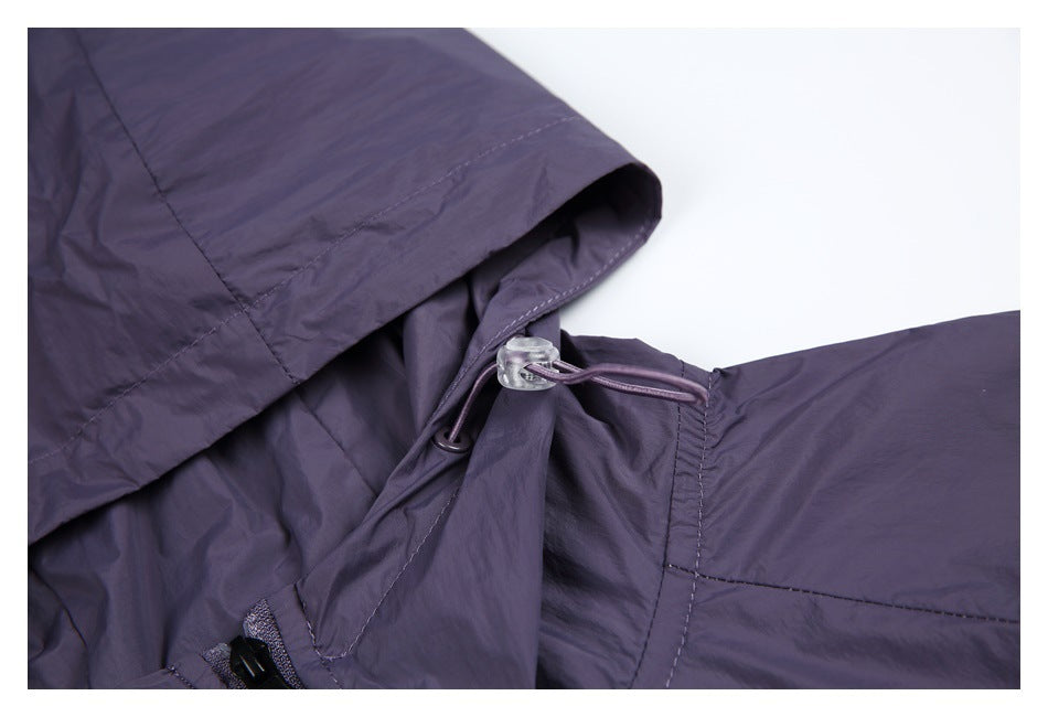 Close-up of the purple hood edge and adjustable drawcord with a clear toggle.