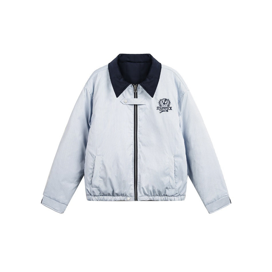 Front view of a pale blue pinstriped jacket with a navy collar, zip closure, pockets and an embroidered chest crest.