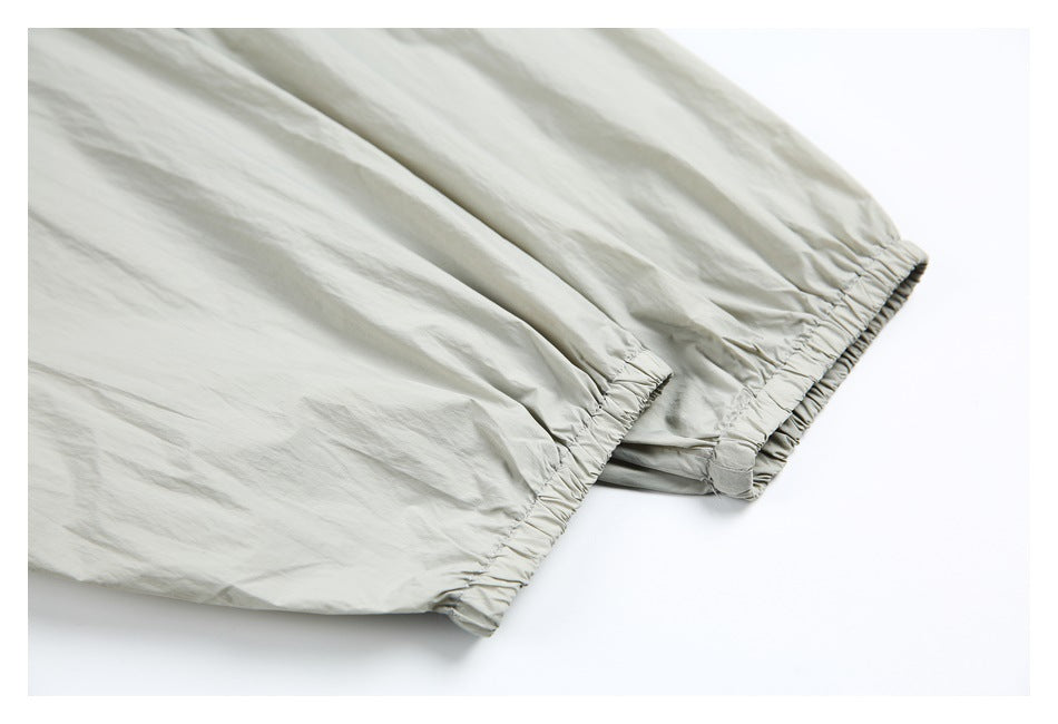 Close-up of the windbreaker’s light gray sleeves and elasticized cuffs.