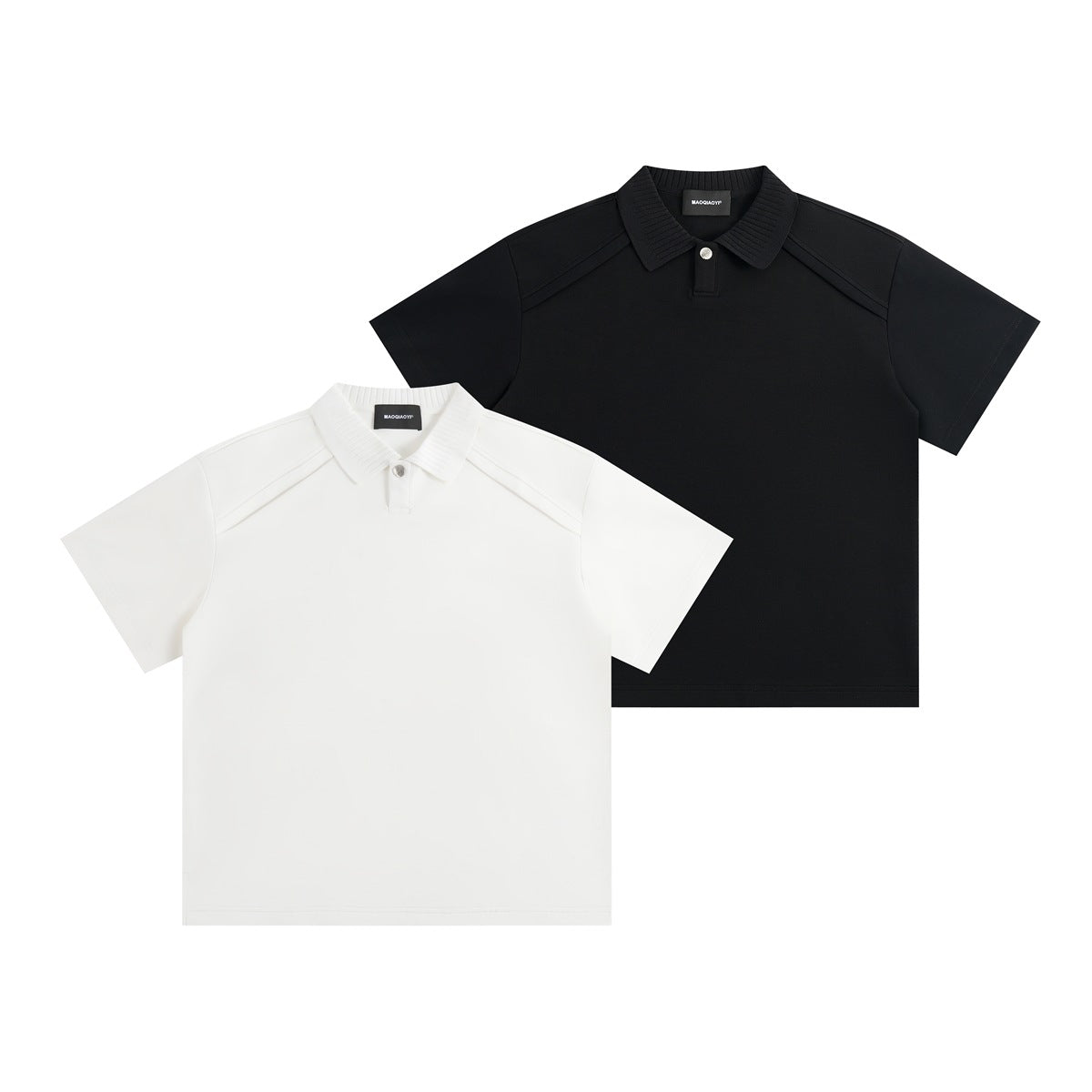 White and black short-sleeve polo shirts shown from the front, with ribbed collars and shoulder seams.