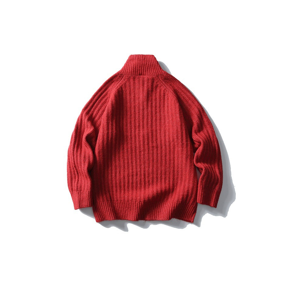 Red ribbed high-collar sweater laid flat, back view