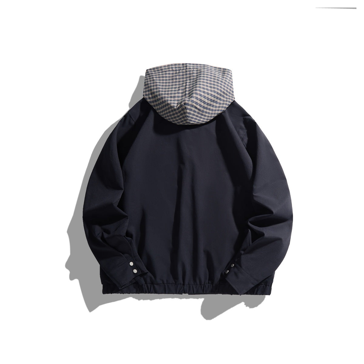 Back view of a navy hooded jacket with a plaid-lined hood and snap-button cuffs.