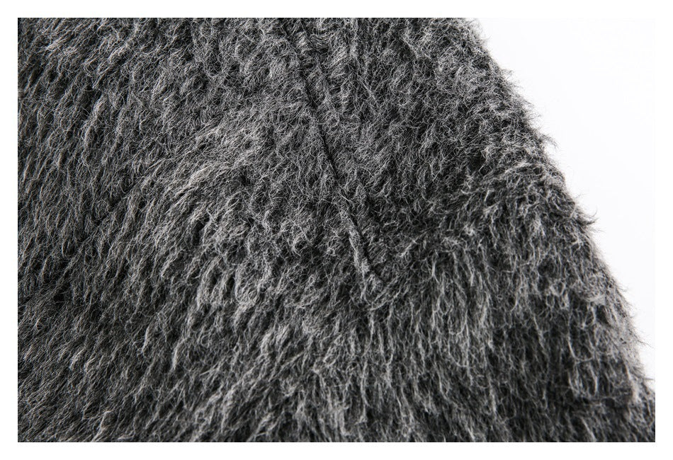 Close-up of shaggy charcoal-gray fabric with a visible seam.