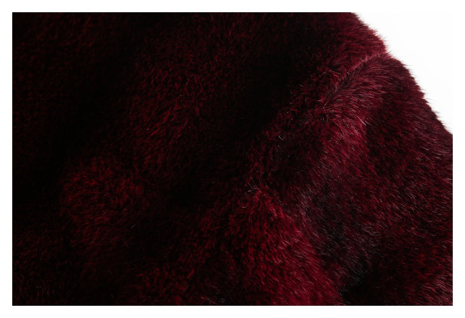 Extreme close-up showing the soft burgundy pile and a raised seam or overlapping panel.