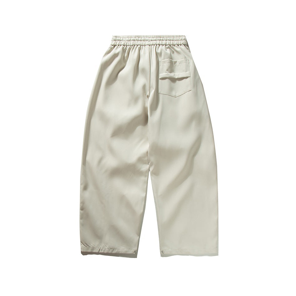 Off-white wide-leg pants, flat back view with elastic waistband and flap back pocket