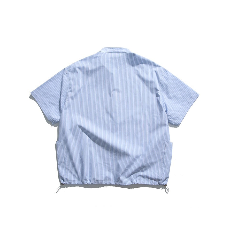 Back view of light blue pinstriped short-sleeve shirt with side pockets and drawcord hem