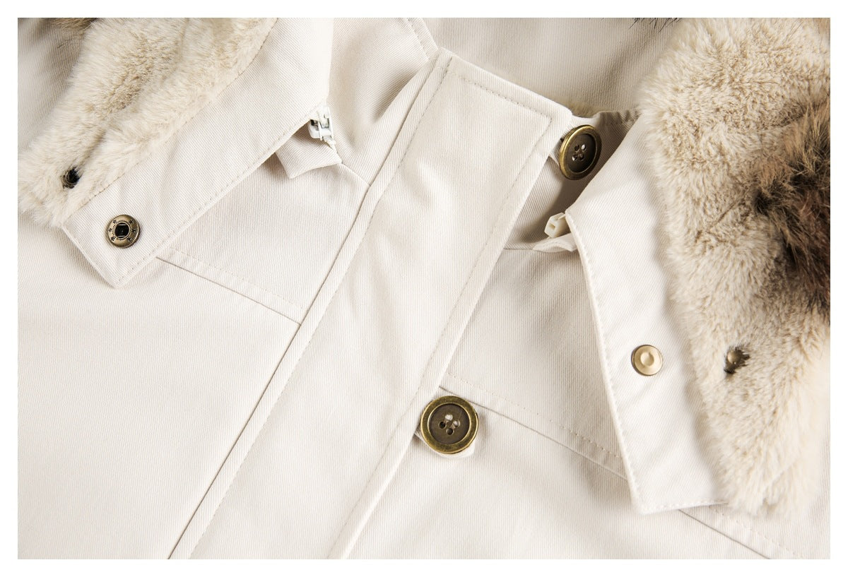 Close-up of the ivory jacket's front placket, brown buttons, snap fasteners and plush hood lining.