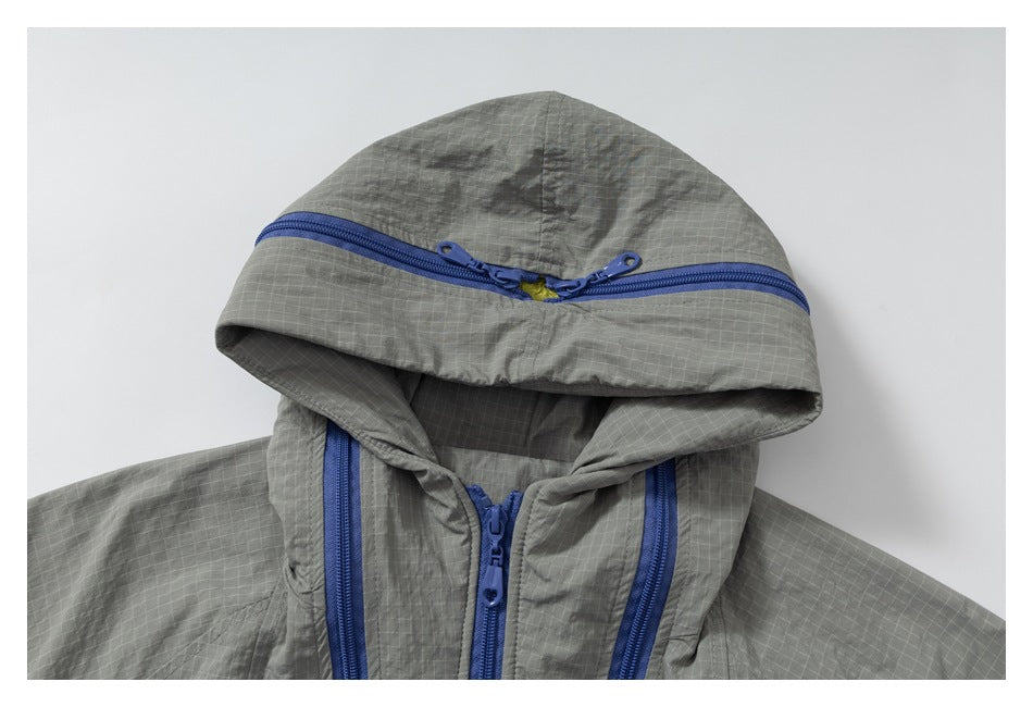 Close-up of the gray hood with a blue zipper and matching front zipper details.