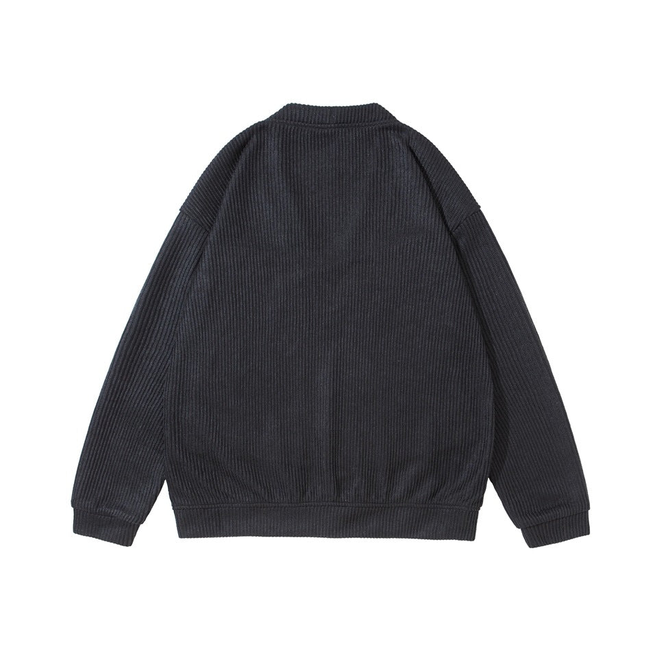 Back view of a black ribbed cardigan with long sleeves and ribbed cuffs and hem.