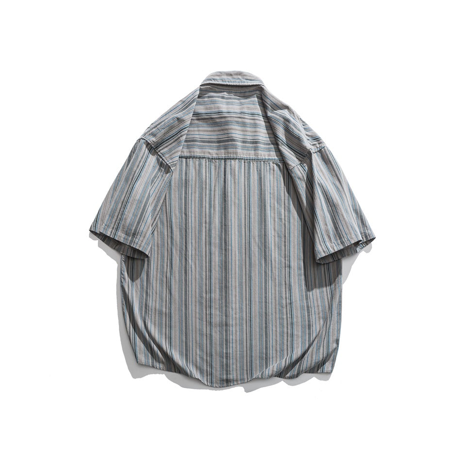 Back view of gray striped short-sleeve shirt with horizontal-striped yoke and vertical-striped lower back
