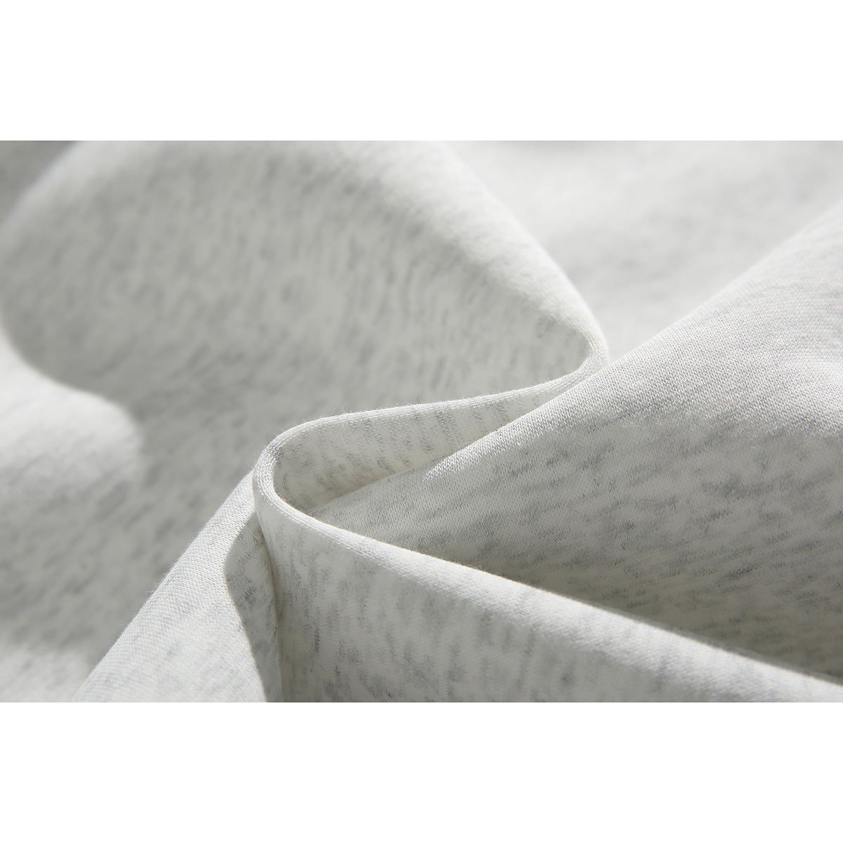 Close-up of folded light gray heathered sweatshirt fabric.