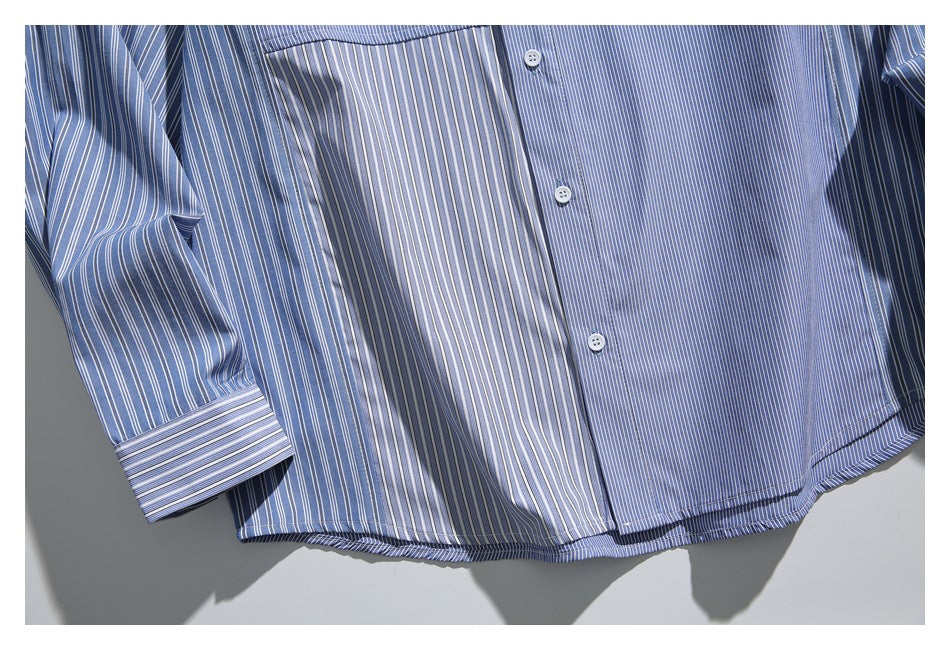 Close-up of the striped shirt's lower front, curved hem, and sleeve cuff.