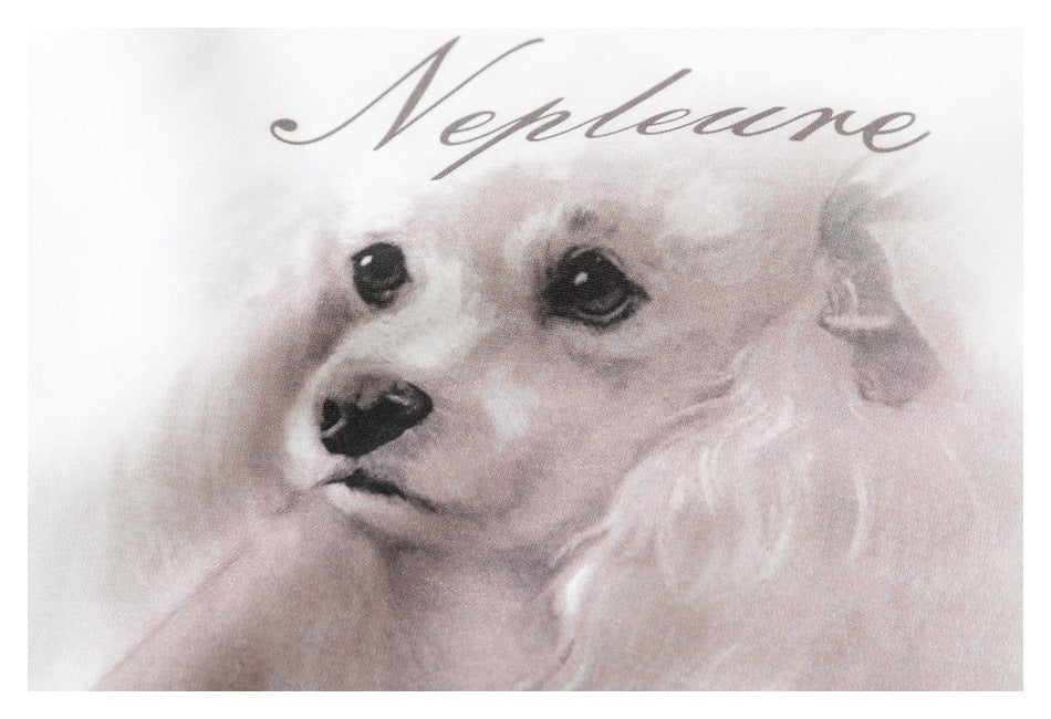 Close-up of the watercolor dog print and “Neptune” lettering on a white sweatshirt.