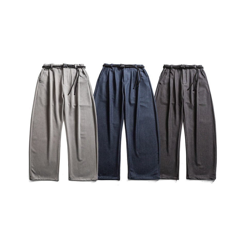 Three pairs of wide-leg drawstring trousers shown from the front in light gray, navy, and charcoal.