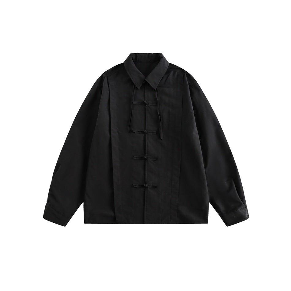 Black long-sleeve collared shirt with five knotted fabric loop closures and tie strands at the collar, flat front view