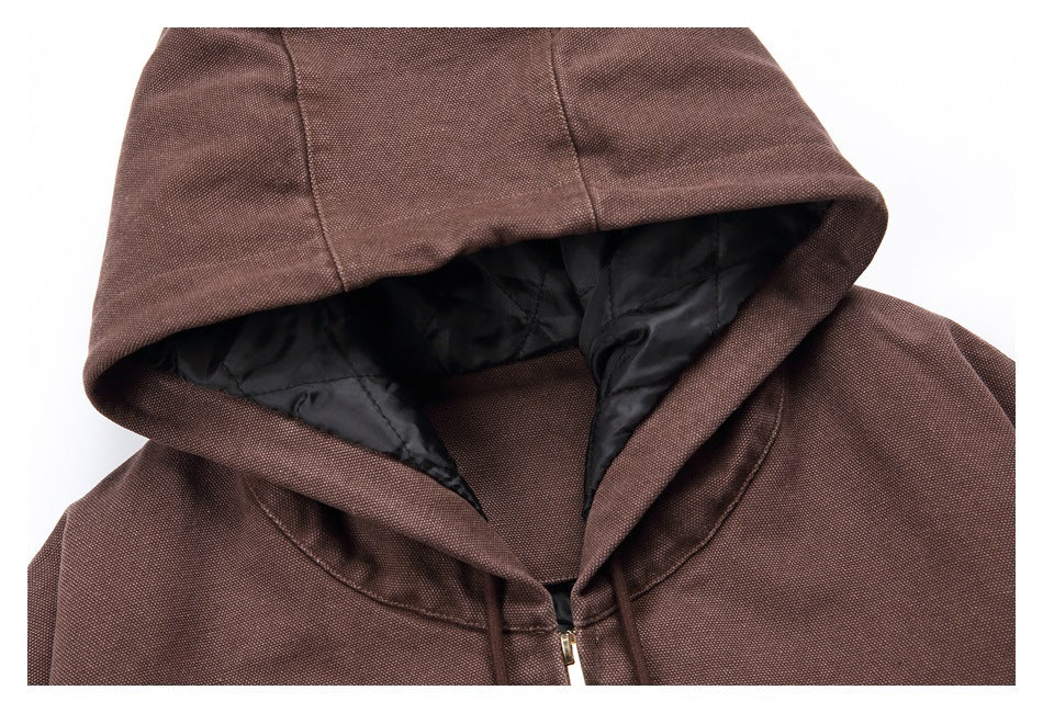 Close-up of the brown hoodie’s hood, showing black quilted lining and matching drawstrings.