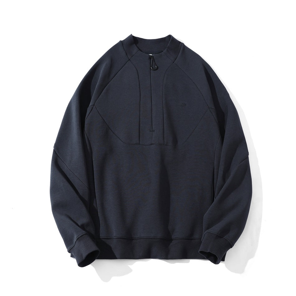 Navy half-zip sweatshirt flat lay with raglan sleeves, paneled chest seams and ribbed cuffs and hem