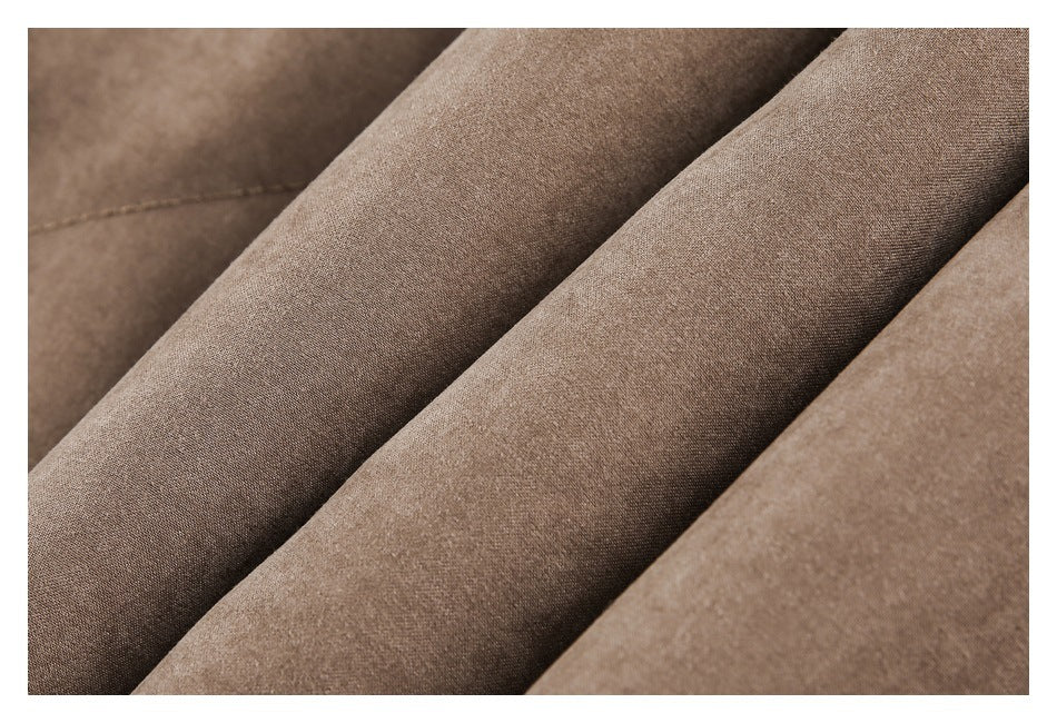 Close-up showing the fine surface texture of brown jacket fabric.