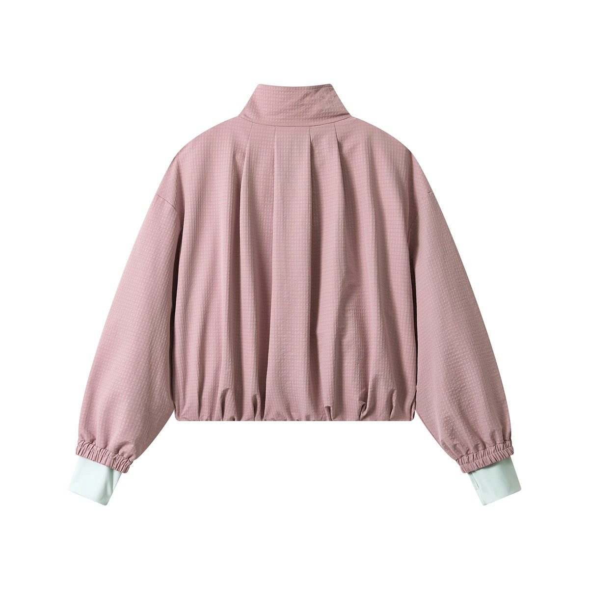 Back view of pink textured cropped jacket with center pleat, gathered hem and mint contrast inner cuffs