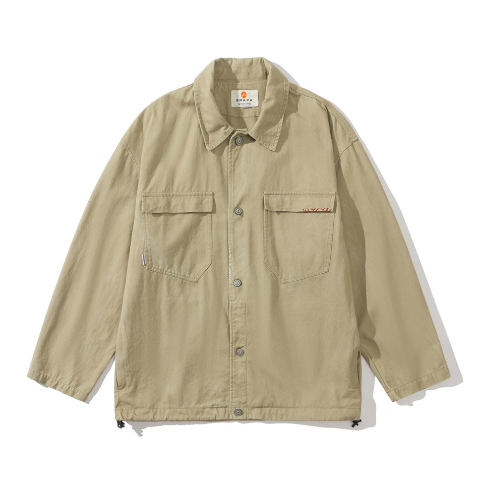 Khaki button-front utility jacket with two chest flap pockets and a drawstring hem, flat lay front view