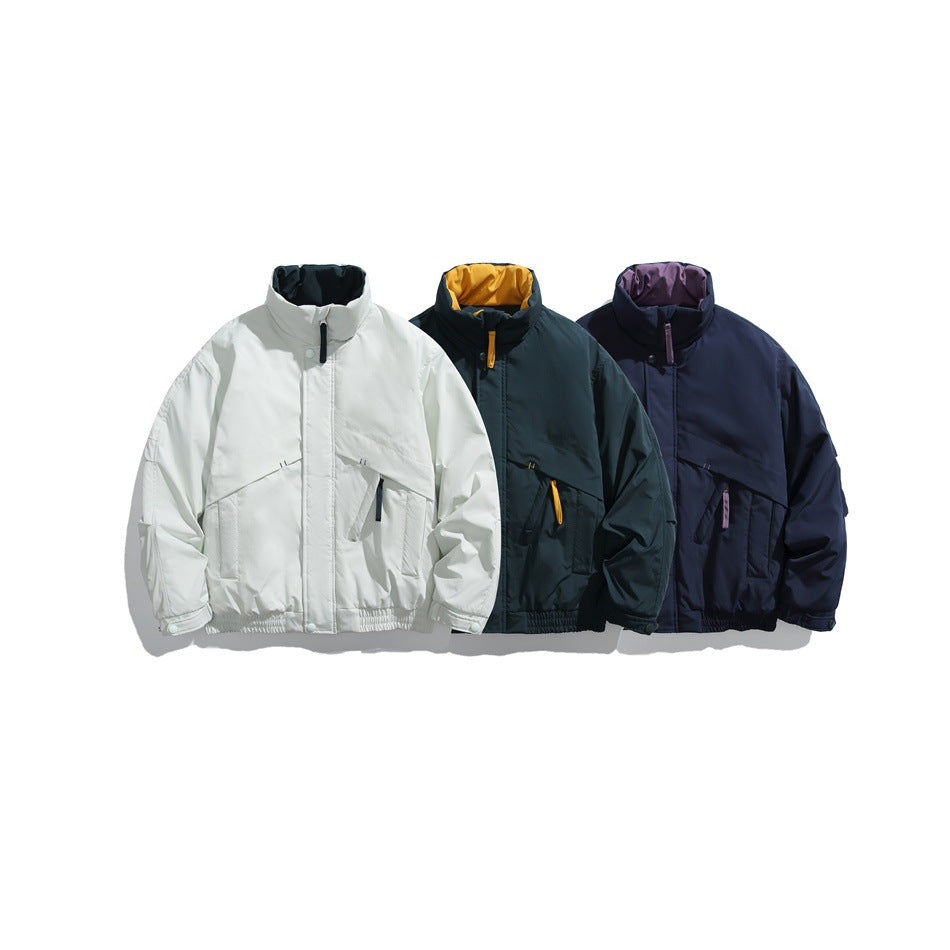 Three high-collar jackets shown together in white, dark teal with a yellow lining, and navy with a purple lining.