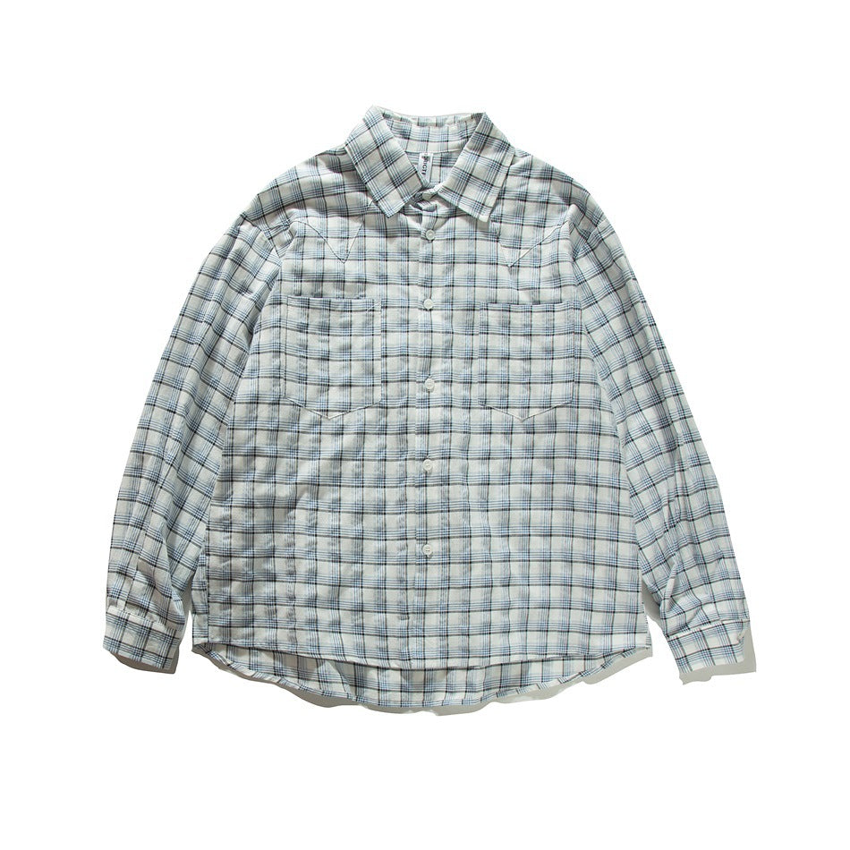 Blue and white plaid long-sleeve button-up shirt with two chest pockets, laid flat, front view