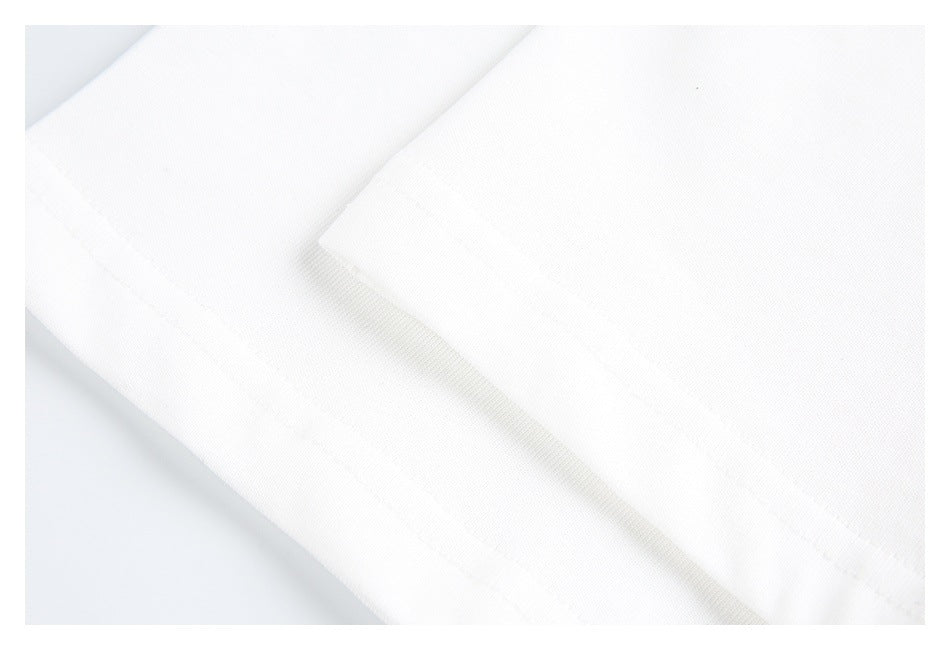 Close-up of the white T-shirt's folded hem and parallel stitching.