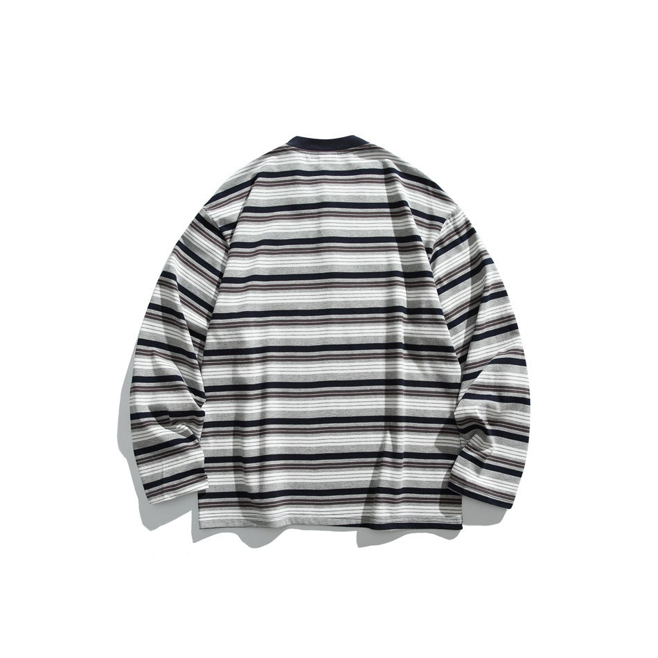 Back view of navy striped long-sleeve top with ribbed round collar, flat lay