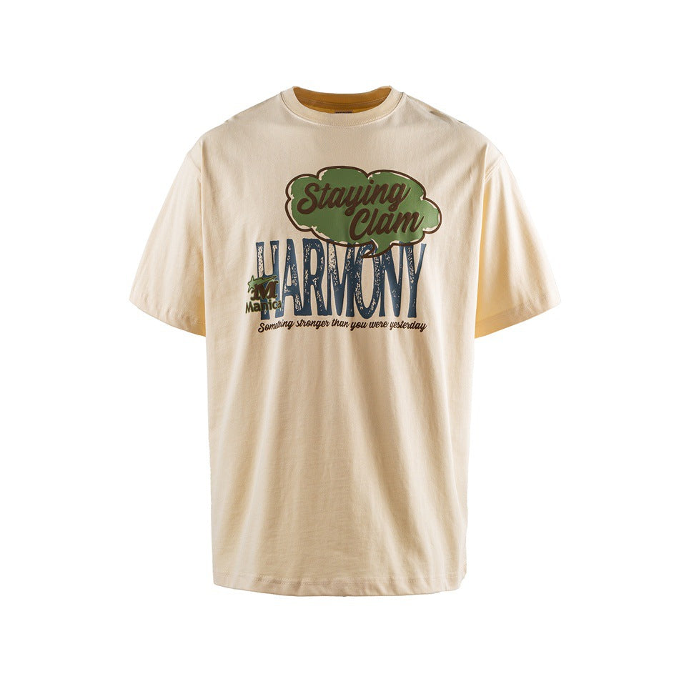 Light apricot short-sleeve crew-neck T-shirt with green and blue Staying Clam HARMONY graphic print on the front