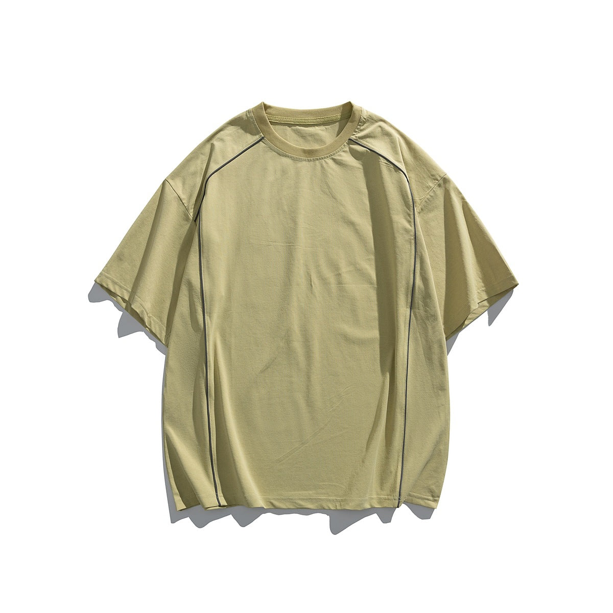 Light olive-yellow short-sleeve crew-neck T-shirt flat lay with thin grey piping along the shoulder and side seams