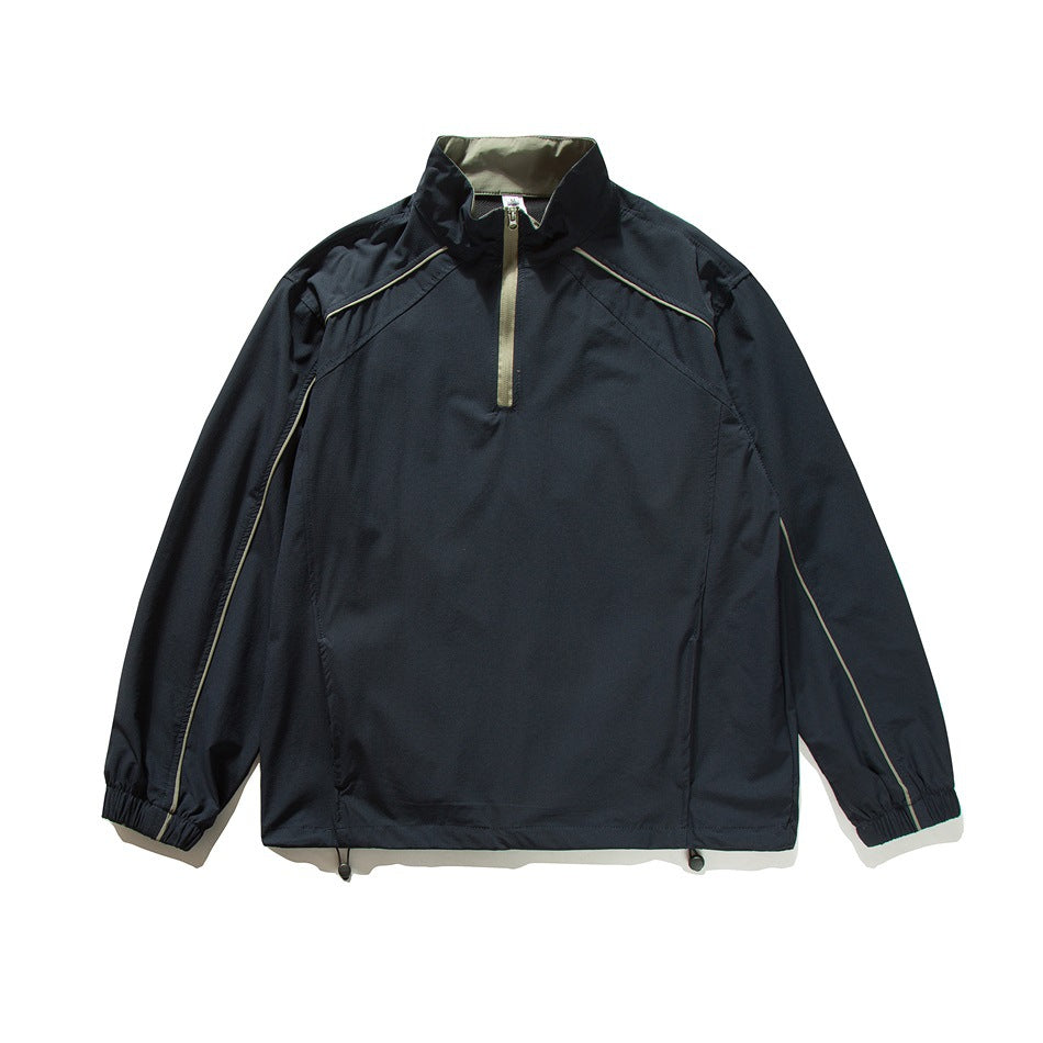 Navy half-zip stand-collar jacket with olive zipper and piping, flat lay front view